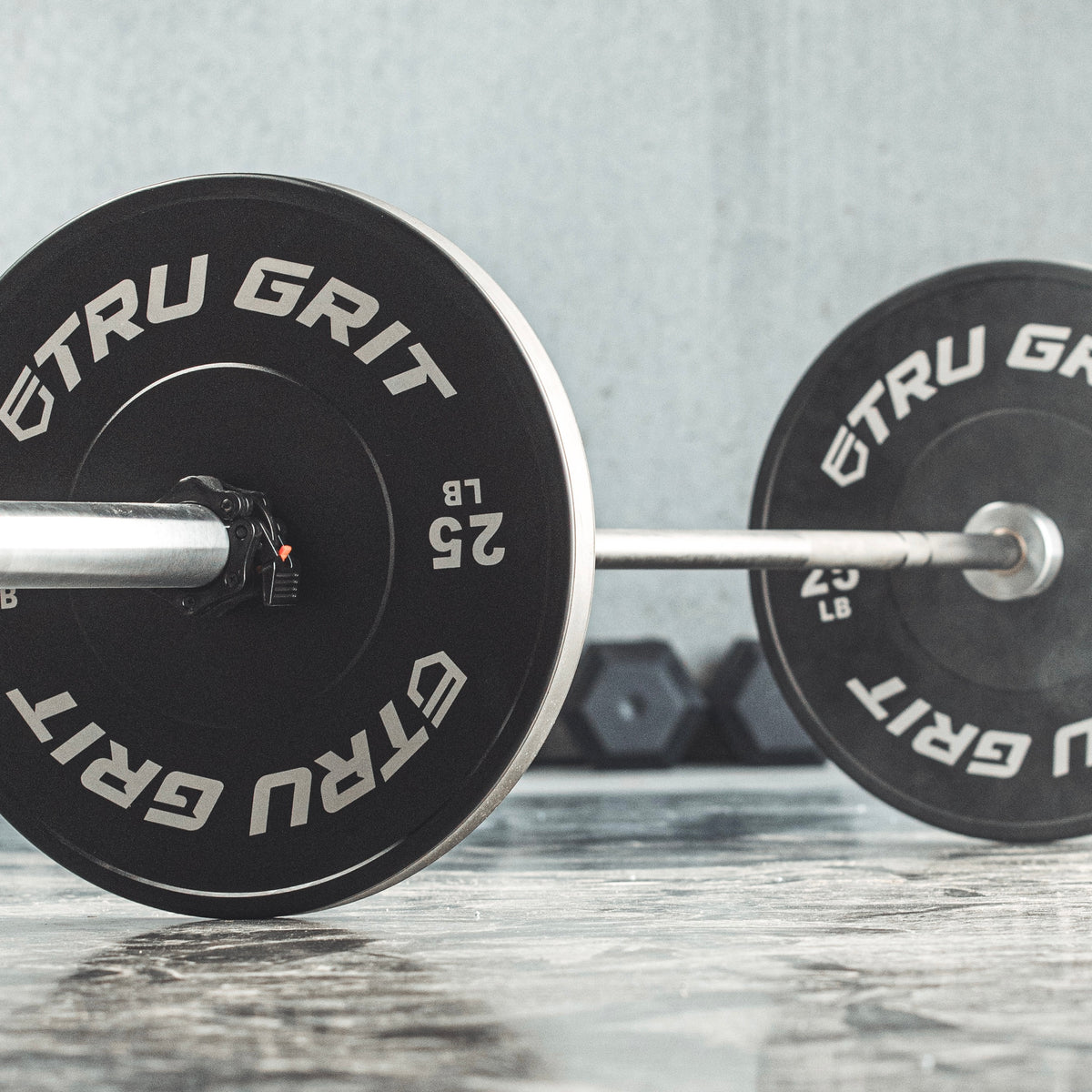 Your Guide To Bumper Plates vs Olympic Plates | Tru Grit Fitness